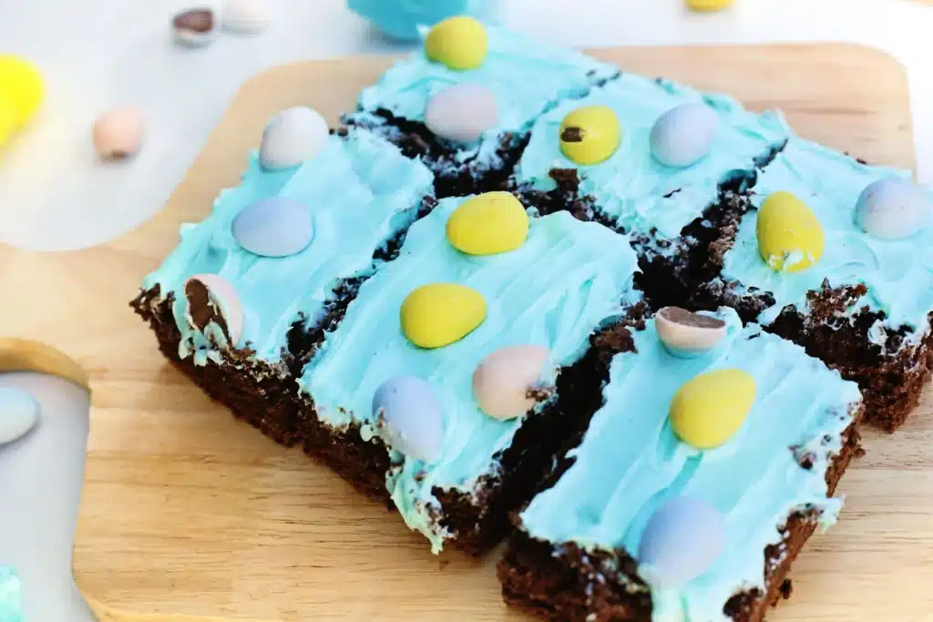 Robin Egg Brownies - Cultivating Brilliant Minds brownies with blue icing and mini cadbury eggs