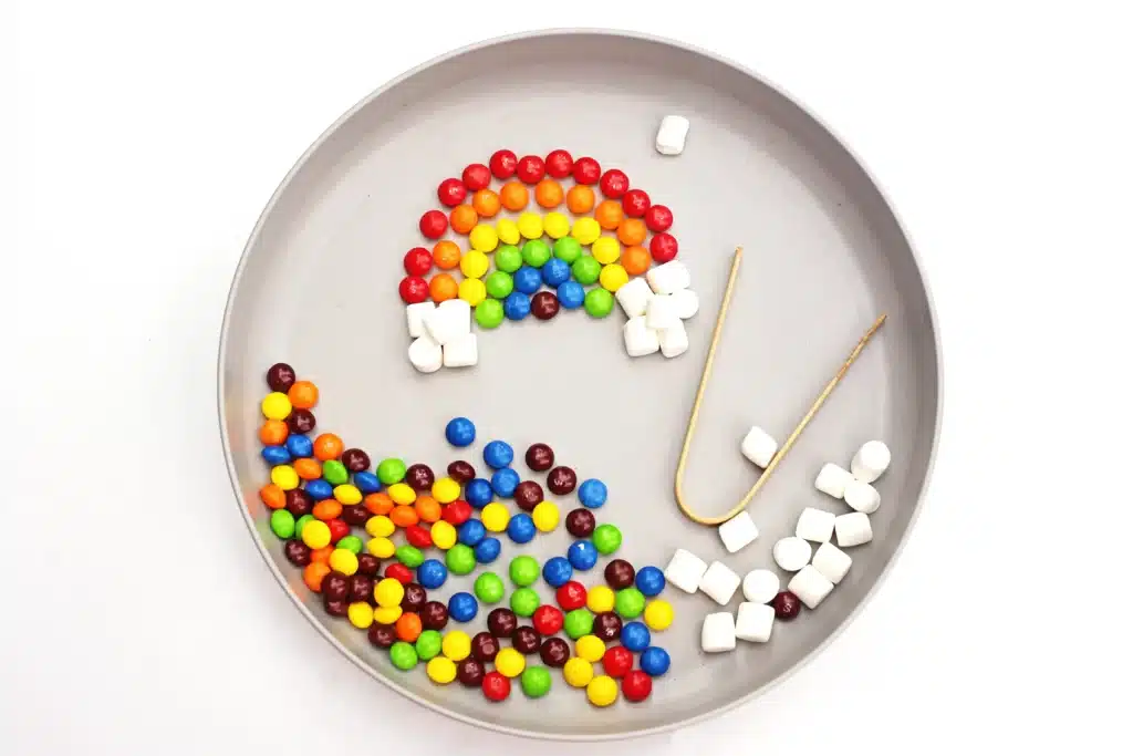 Skittles Rainbow Fine Motor Activity - Cultivating Brilliant Minds a skittles rainbow fine motor activity where kids separate skittles and make a rainbow out the them