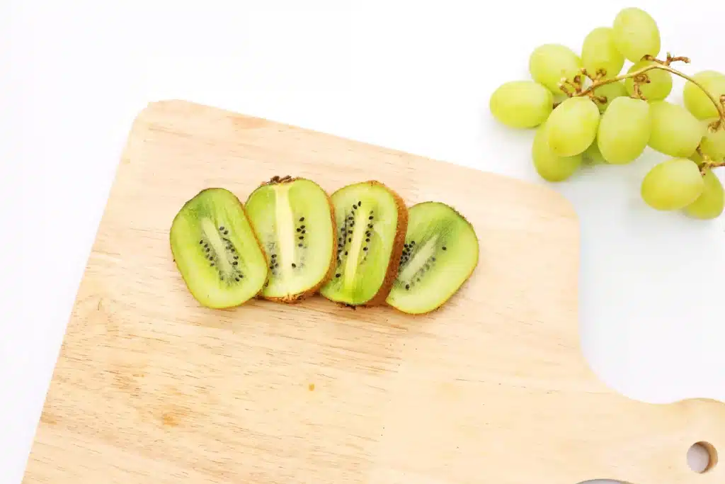 Yertle the Turtle Fruit - Cultivating Brilliant Minds kiwi cut in half on a cutting board