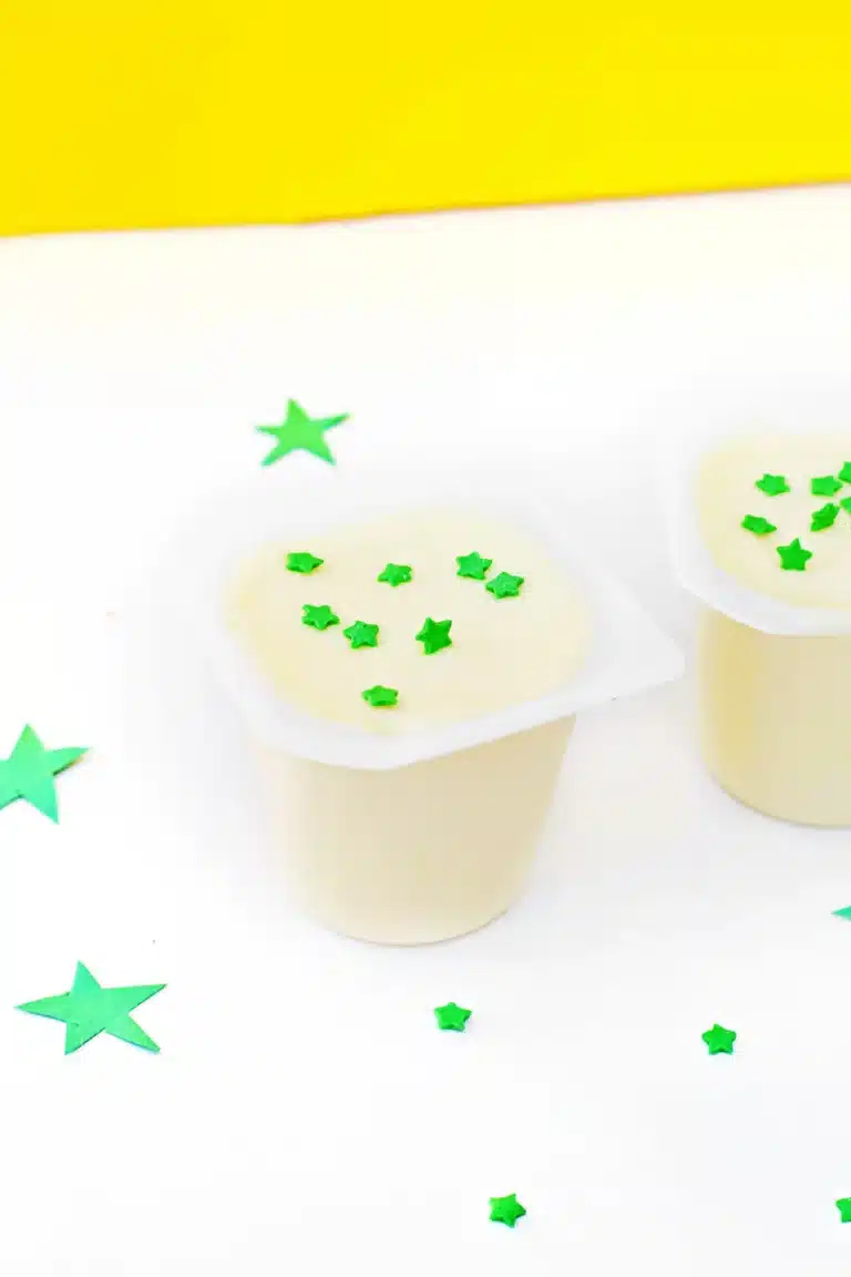 vanilla pudding cups with green star sprinkles inside