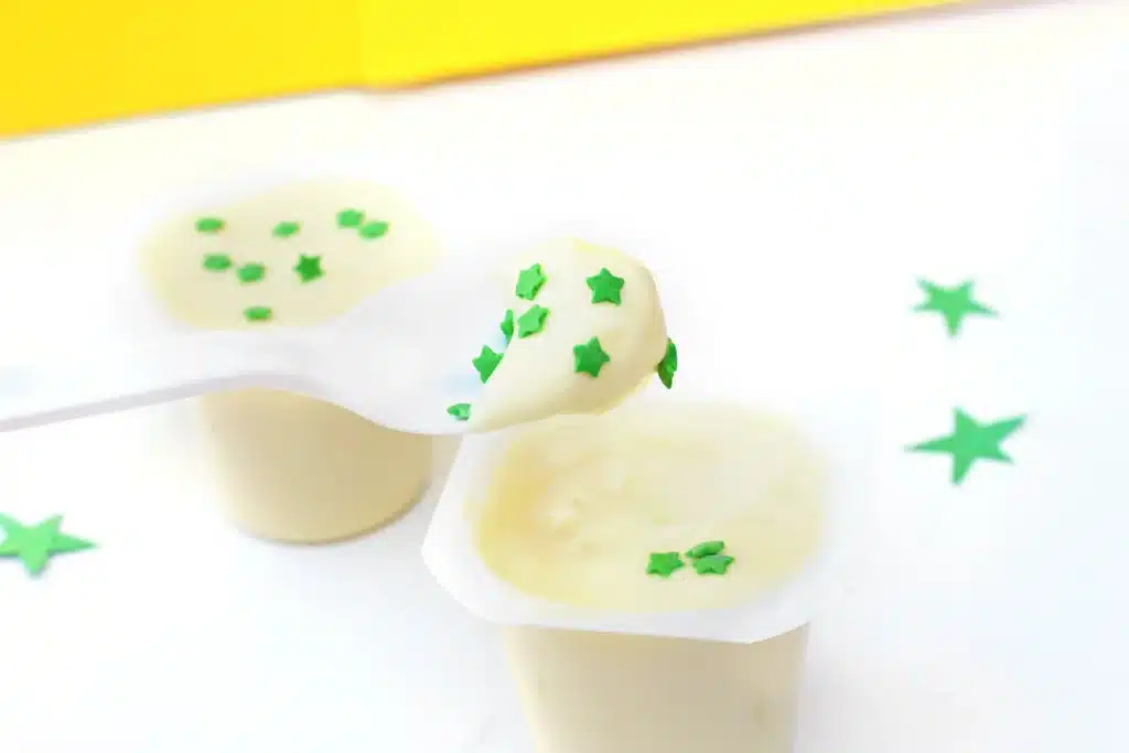 Sneetches Pudding Cups - Cultivating Brilliant Minds vanilla pudding cups with green star sprinkles inside