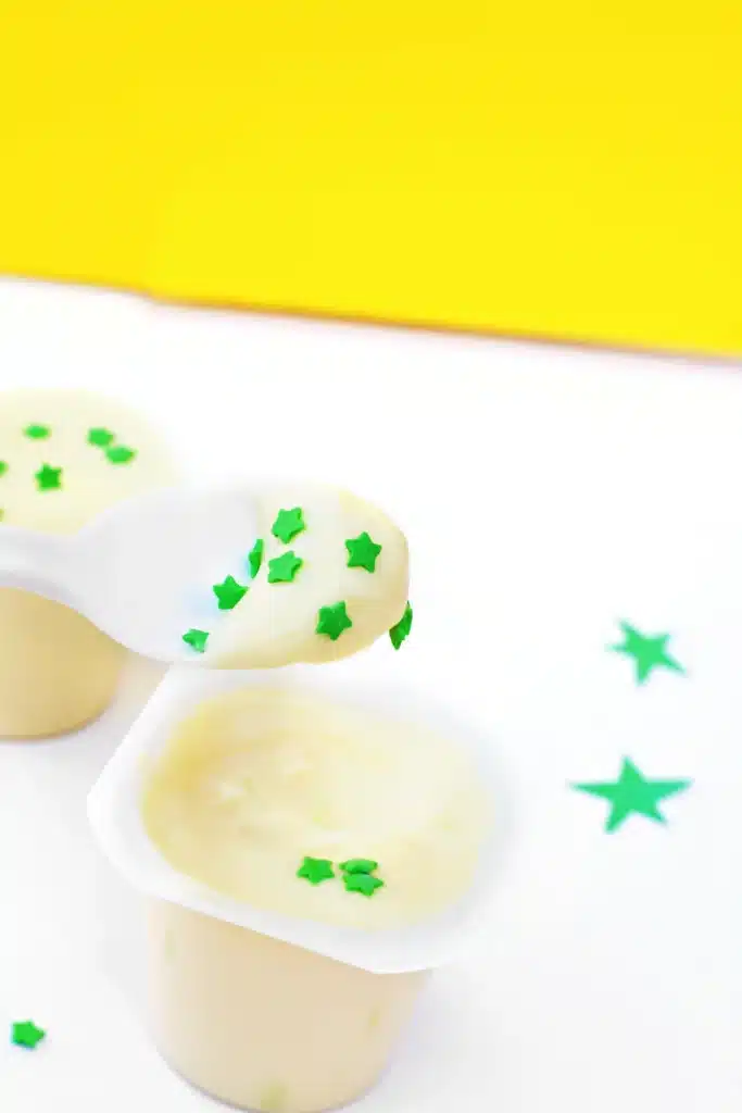 Sneetches Pudding Cups - Cultivating Brilliant Minds vanilla pudding cups with green star sprinkles inside