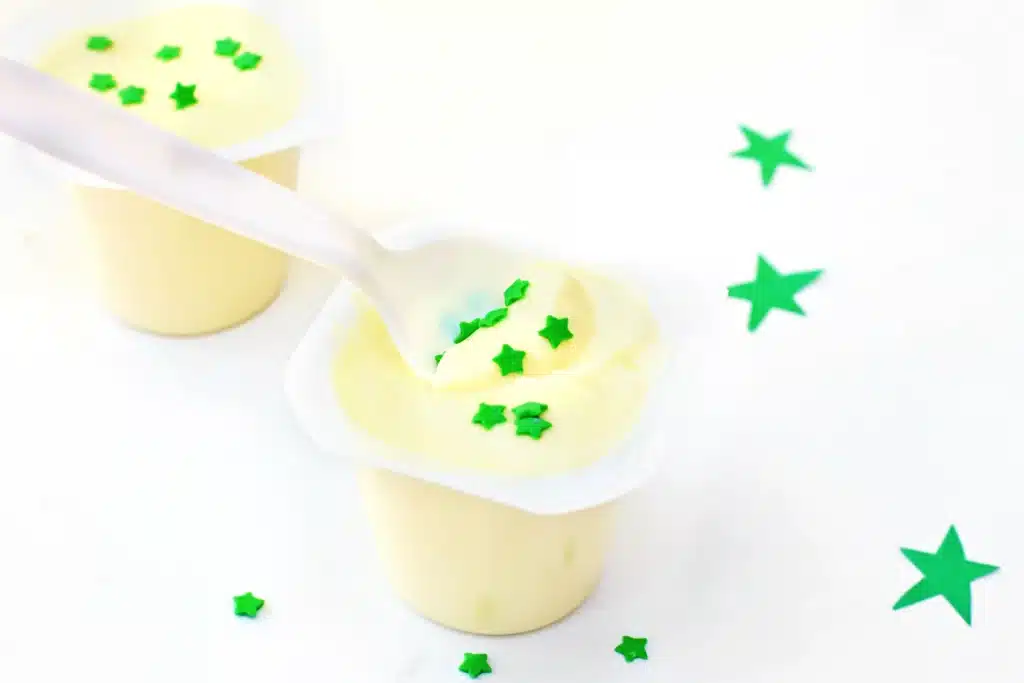 Sneetches Pudding Cups - Cultivating Brilliant Minds vanilla pudding cups with green star sprinkles inside