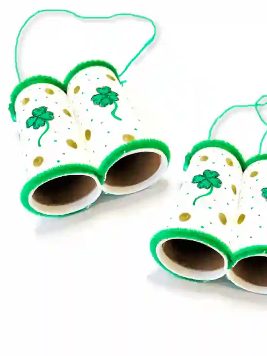 St. Patrick's Day Crafts For Kids - Cultivating Brilliant Minds a pair of binoculars made out of toilet paper rolls and decorated with shamrocks and gold coins