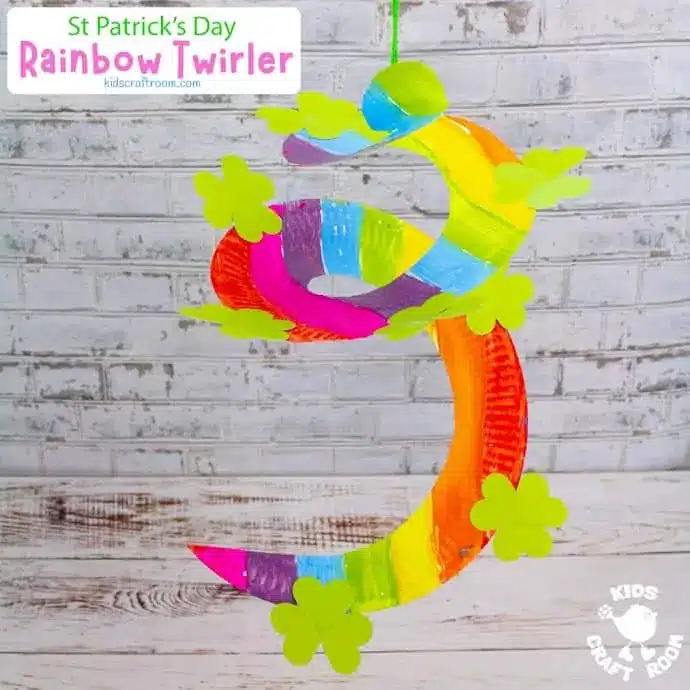 St. Patrick's Day Paper Plate Crafts - Cultivating Brilliant Minds a paper plate painted like a rainbow and cut into a spiral to make a twirler