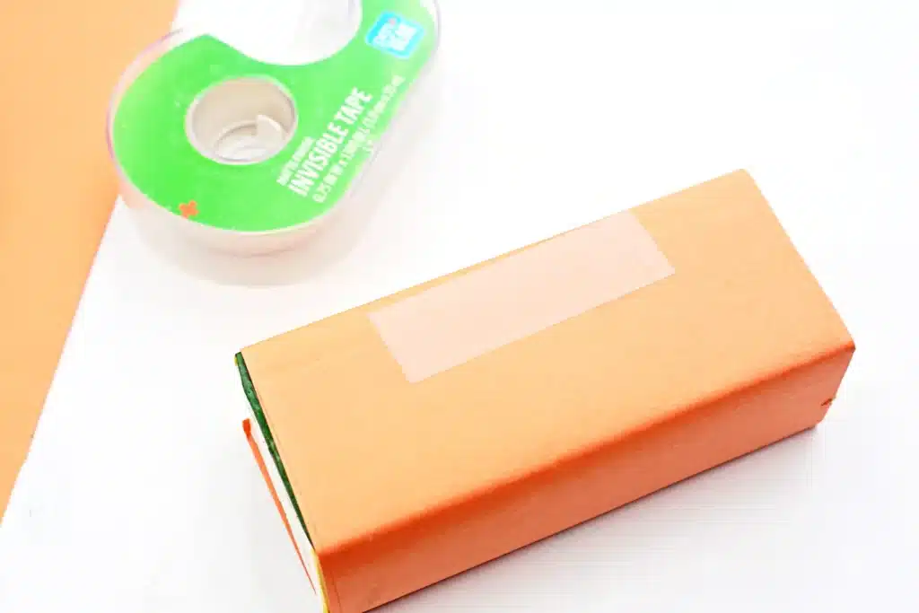 Dr. Seuss The Lorax Juice Boxes - Cultivating Brilliant Minds a juice box wrapped in orange construction paper