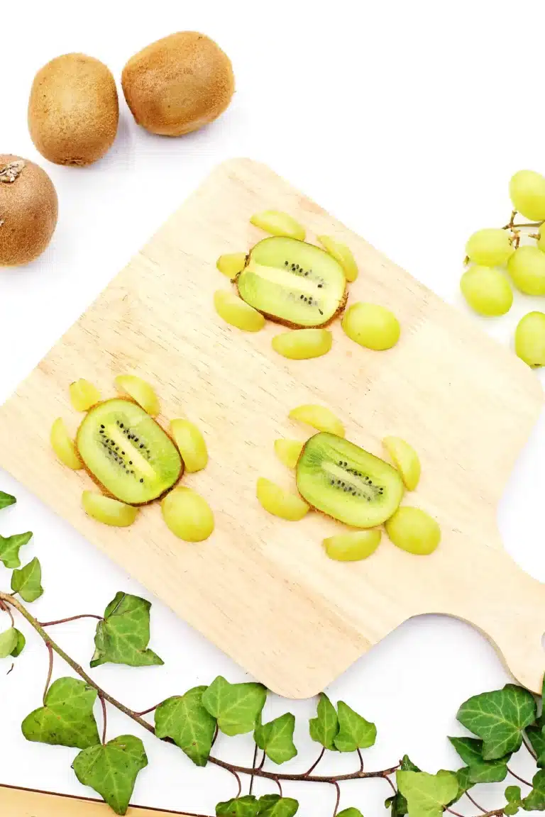 Yertle the Turtle Fruit that has a cut kiwi and grapes arranged to look like a turtle