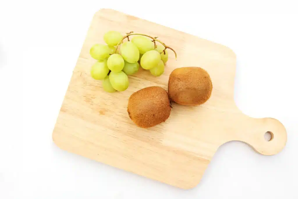 Yertle the Turtle Fruit - Cultivating Brilliant Minds kiwi and green grapes on a cutting board