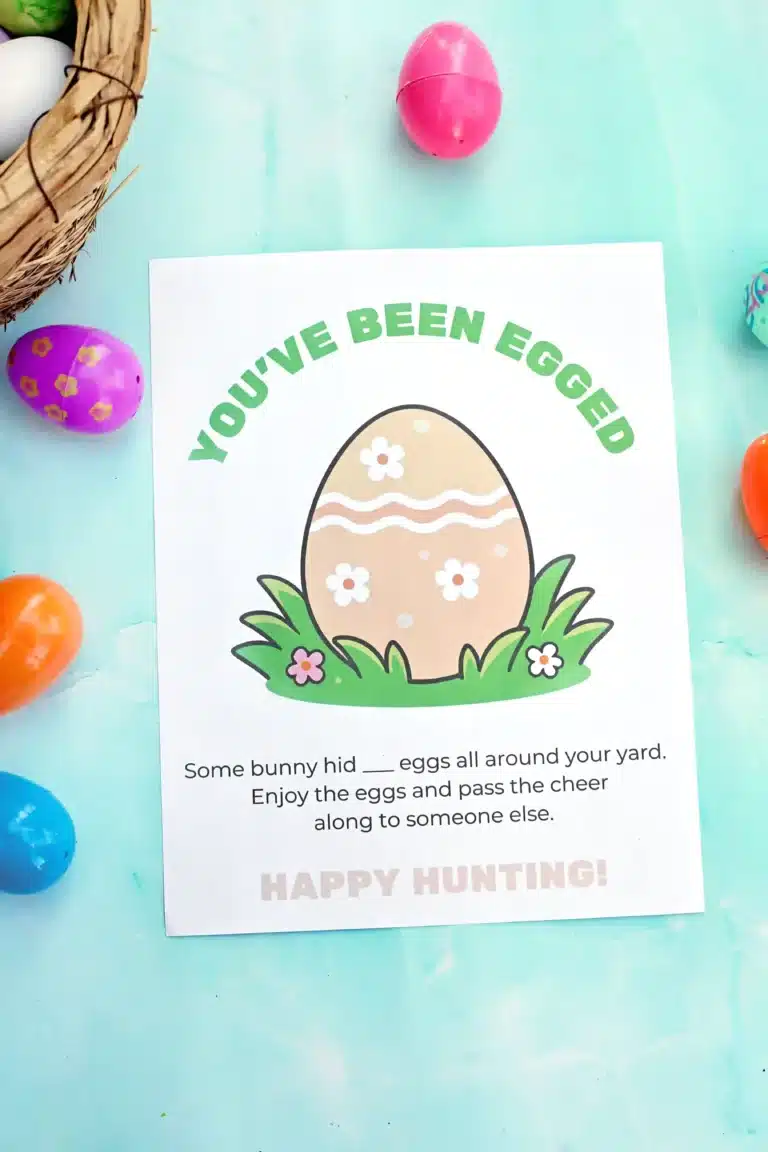a printable that reads “You’ve Been Egged! Some bunny hid ___ eggs all around your yard. Enjoy the eggs and pass the cheer along to someone else.”