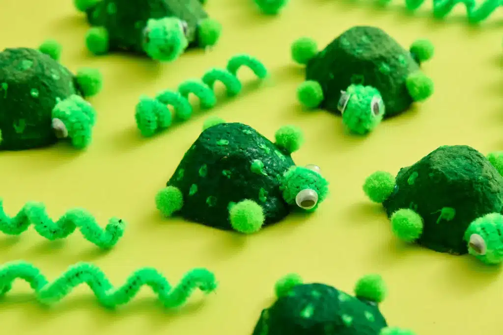 Egg Carton Turtle Craft - Cultivating Brilliant Minds egg cartons cut and painted green to look like turtles