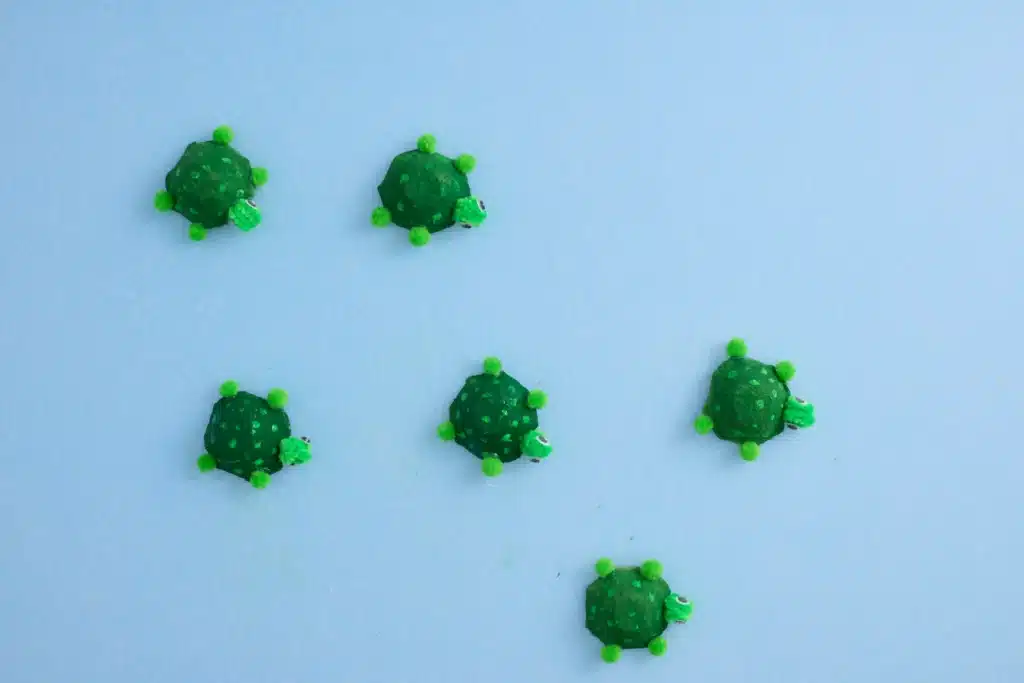 Egg Carton Turtle Craft - Cultivating Brilliant Minds egg cartons cut and painted green to look like turtles