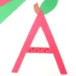 Letter A Apple Craft - Cultivating Brilliant Minds the letter a cut out of red construction paper with a leaf and stem glued on top