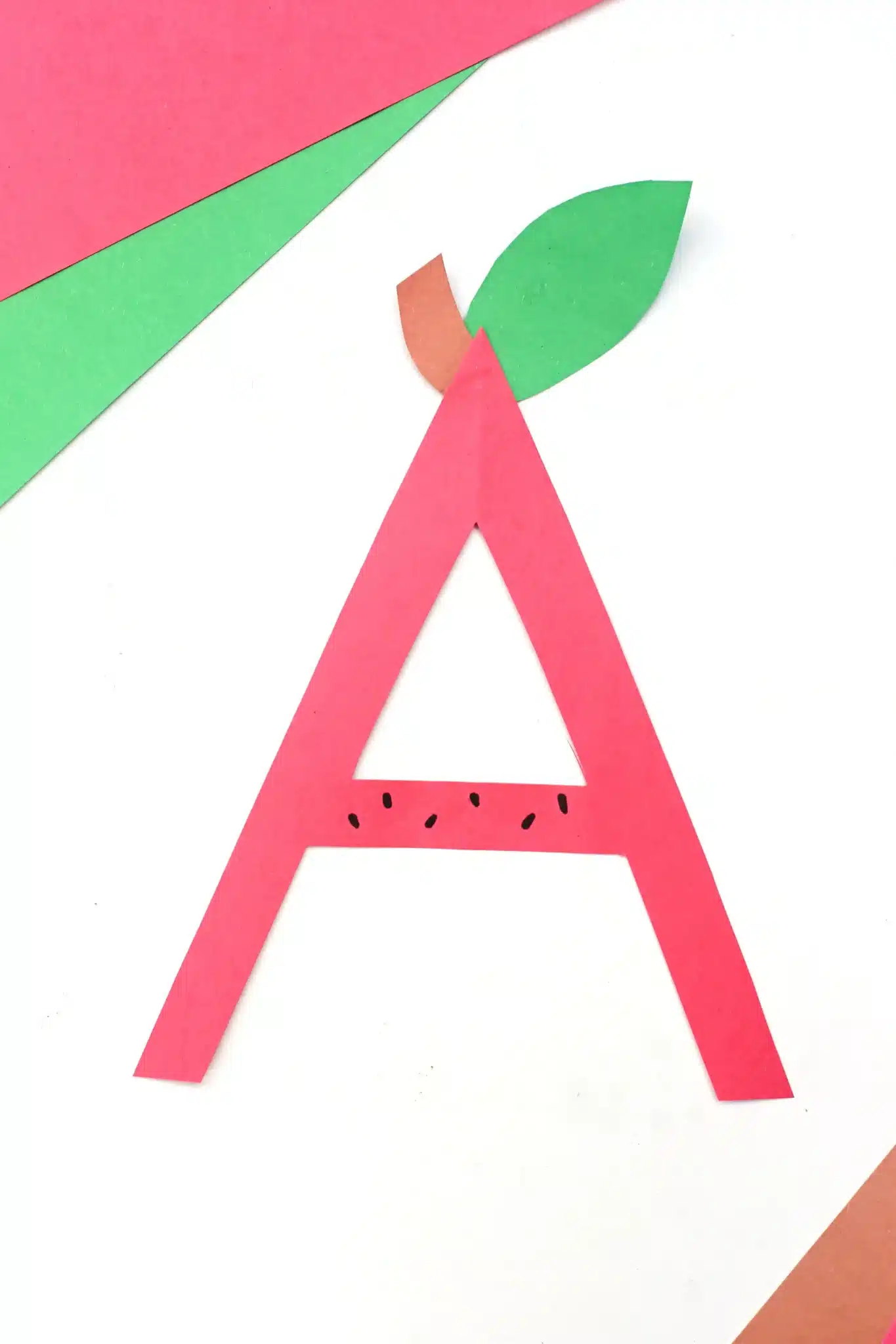 a construction paper A decorated to look like an apple