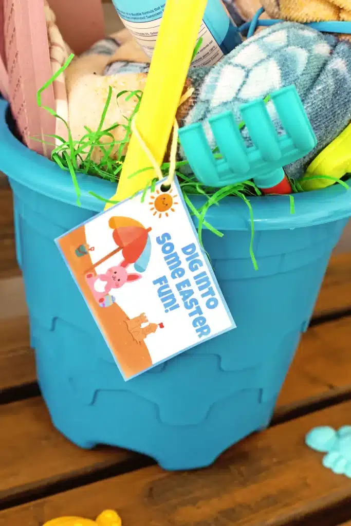 Beach Easter Basket Idea - Cultivating Brilliant Minds a printable easter tag that reads "dig into some easter fun" with a picture of a bunny on the beach