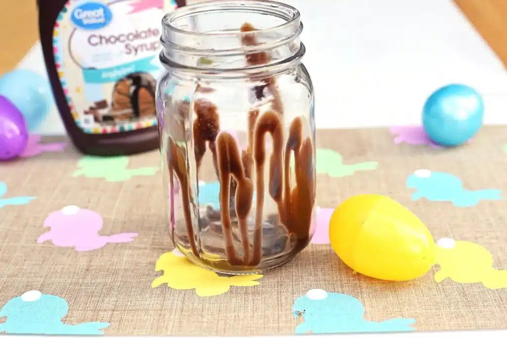 Chocolate Bunny Milkshake - Cultivating Brilliant Minds chocolate syrup drizzled inside a glass