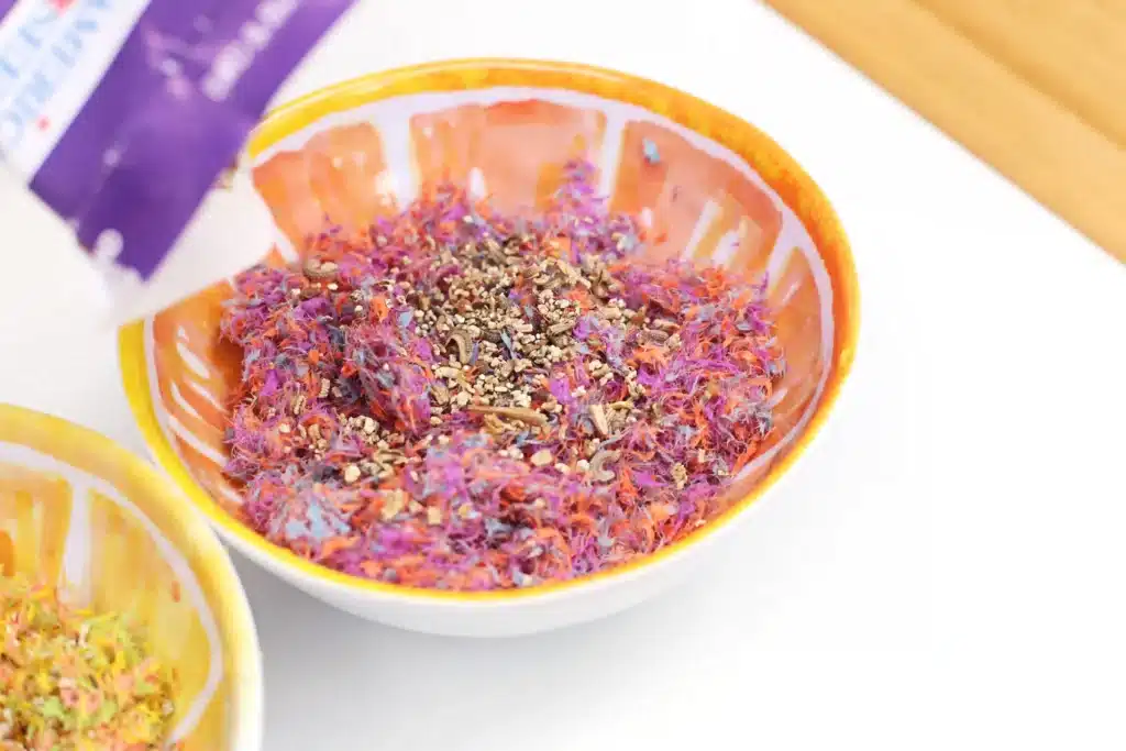 DIY Easter Egg Seed Bombs - Cultivating Brilliant Minds seeds added to construction paper that was soaked in water and blended