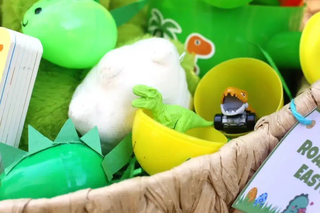 Dinosaur Easter Basket For Kids - Cultivating Brilliant Minds an easter basket with plastic easter eggs with dinosaur toys inside