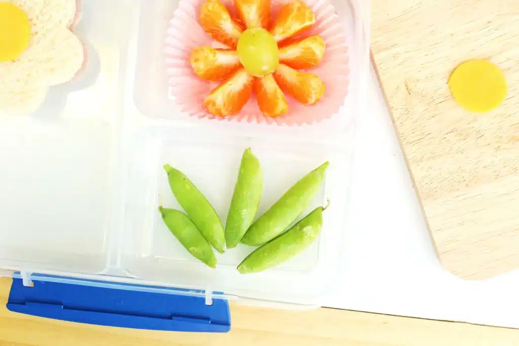 Flower Garden Lunch - Cultivating Brilliant Minds snap peas arranged to look like leaves of a flower