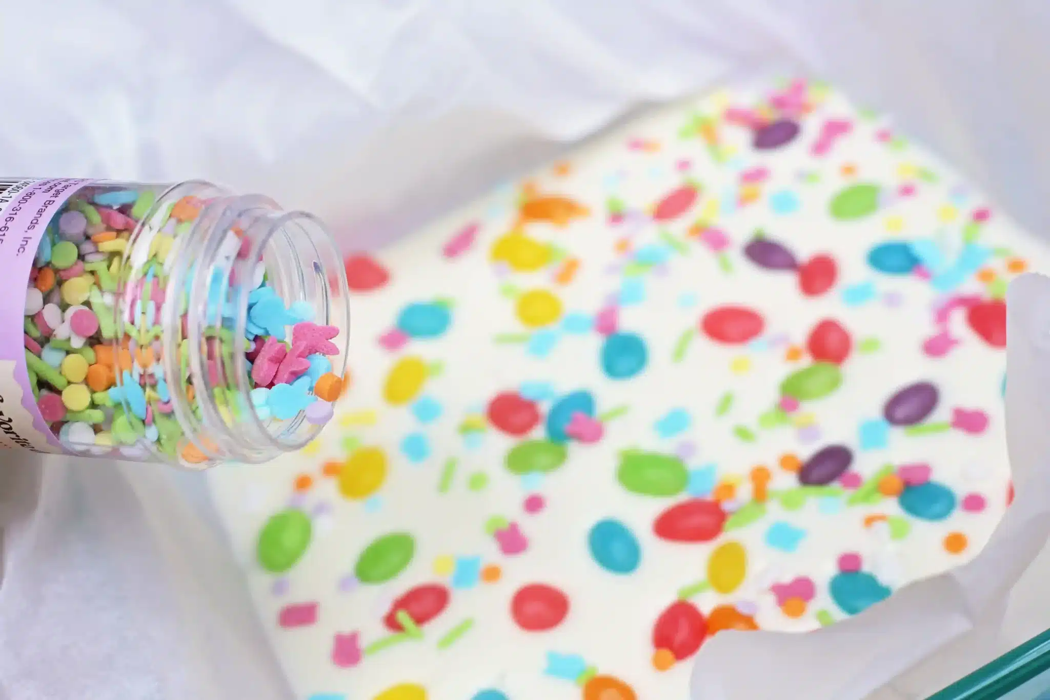 Jelly Bean Bark For Easter - Cultivating Brilliant Minds sprinkles and jelly beans added to melted white chocolate