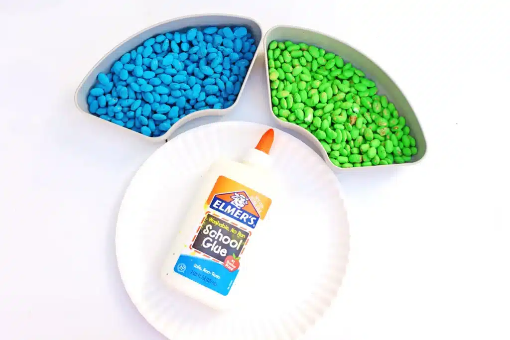 Bean Earth Day Mosaic - Cultivating Brilliant Minds glue, a paper plate. and blue and green dyed pinto beans