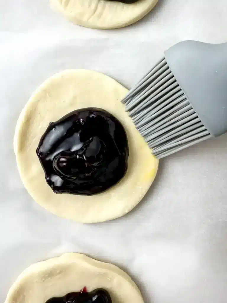 Blueberry Earth Day Hand Pies - Cultivating Brilliant Minds puff pastry cut into a circle with blueberry pie filling
