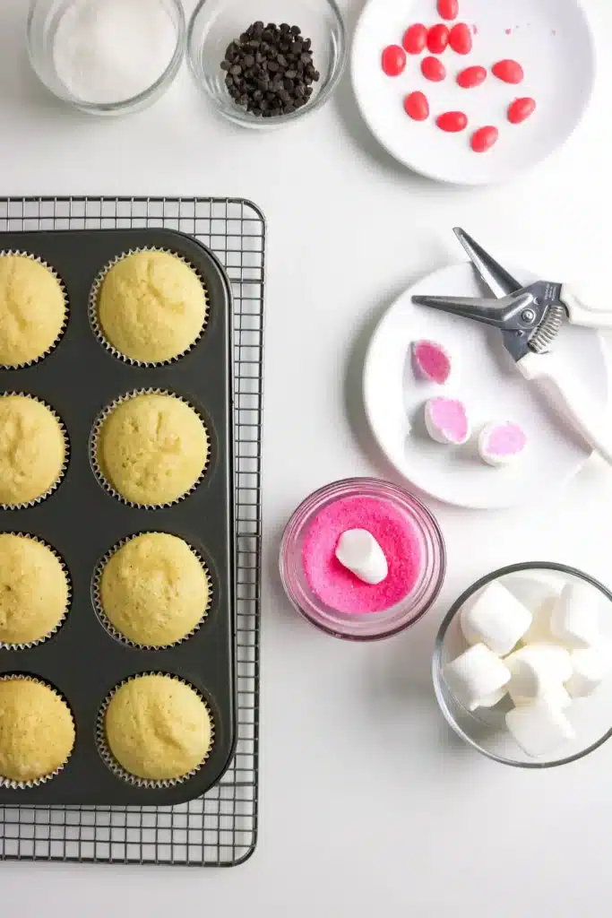 Bunny Cupcakes for Easter - Cultivating Brilliant Minds a marshmallow cut in half and dipped in pink sanding suagr