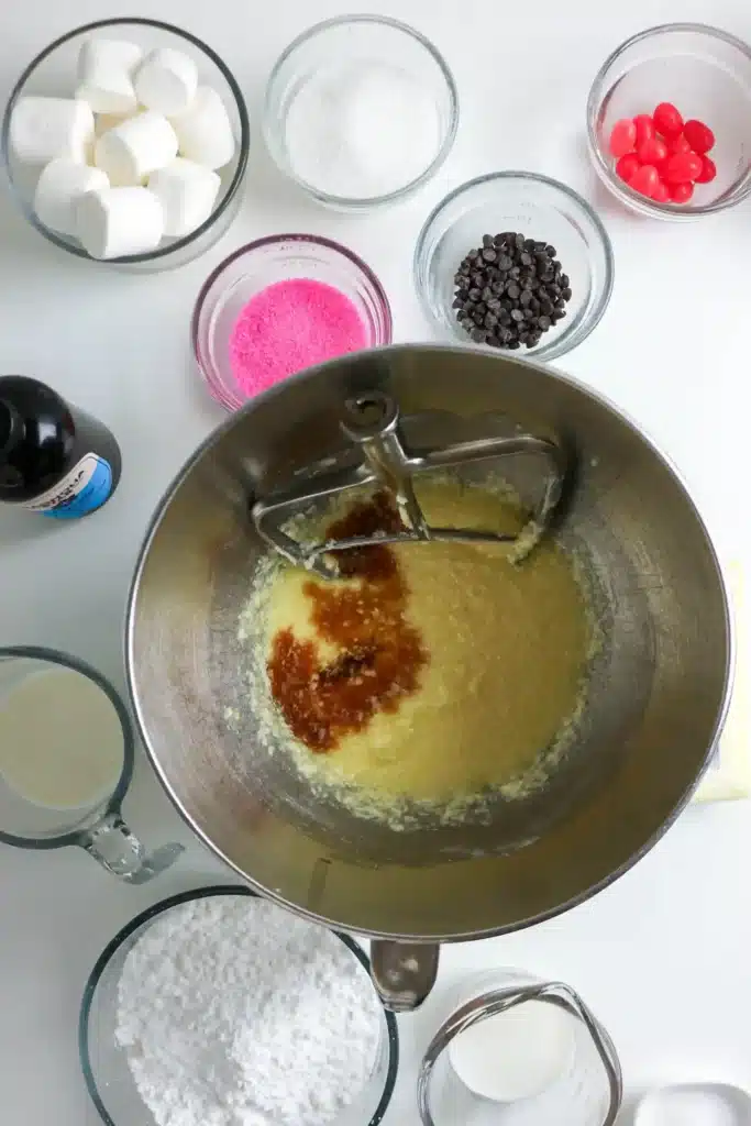 Bunny Cupcakes for Easter - Cultivating Brilliant Minds sugar, butter, eggs, and vanilla in a mixing bowl