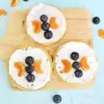 Butterfly Garden Waffles: A Spring Breakfast Idea For Kids - Cultivating Brilliant Minds waffles with whipped cream and blueberries and oranges arranged to look like a butterfly