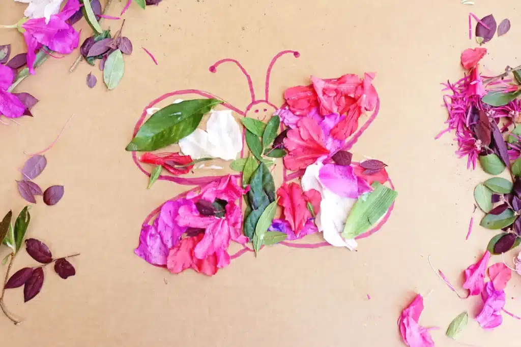 Butterfly Nature Collage - Cultivating Brilliant Minds a butterfly drawn on cardboard with flowers and leaves glued on it