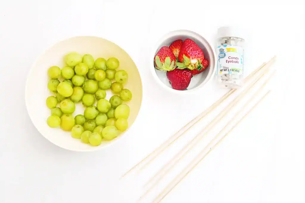 Caterpillar Grape Skewers - Cultivating Brilliant Minds green grapes, skewers, strawberries, and candy eyes