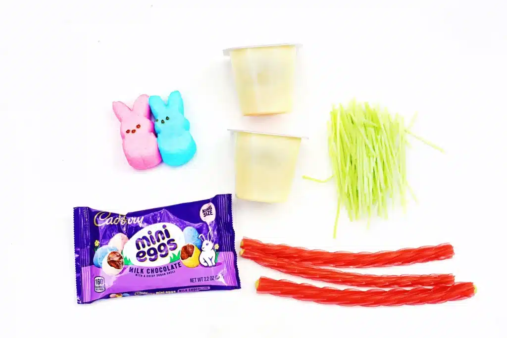 Easter Basket Pudding Cups - Cultivating Brilliant Minds vanilla pudding cups, twizzlers, edible grass, peeps, and cadbury mini eggs