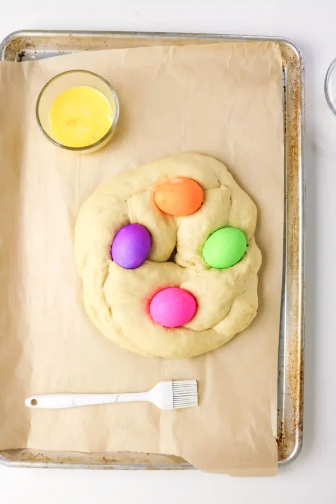 Italian Easter Bread Recipe - Cultivating Brilliant Minds italian easter bread dough with colored eggs on top