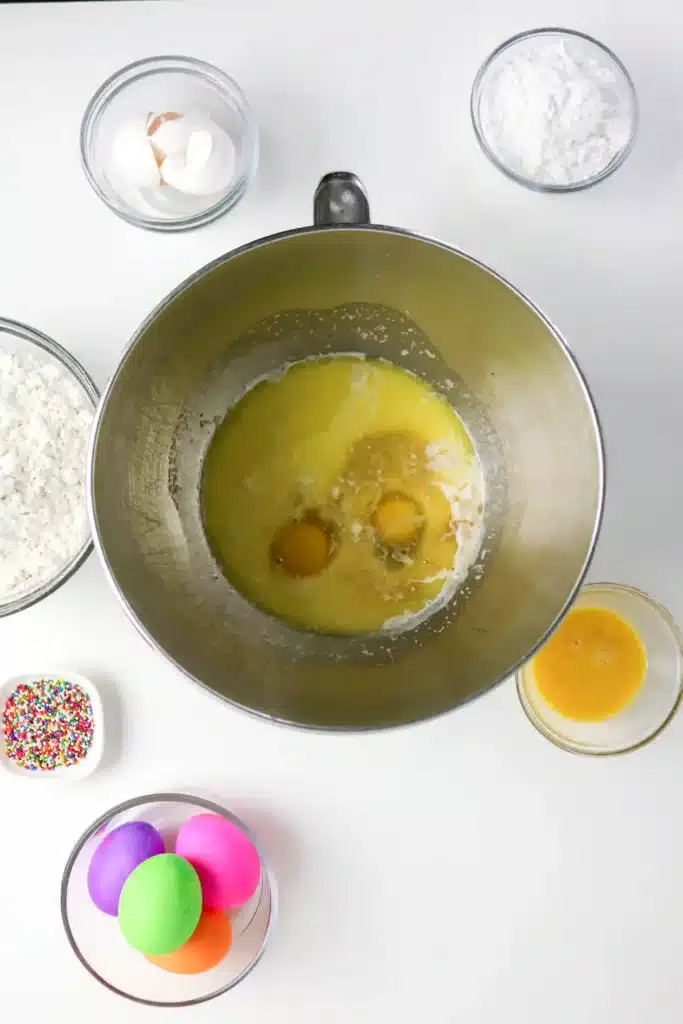 Italian Easter Bread Recipe - Cultivating Brilliant Minds eggs, sugar, butter, salt, vanilla, and almond extract in a bowl