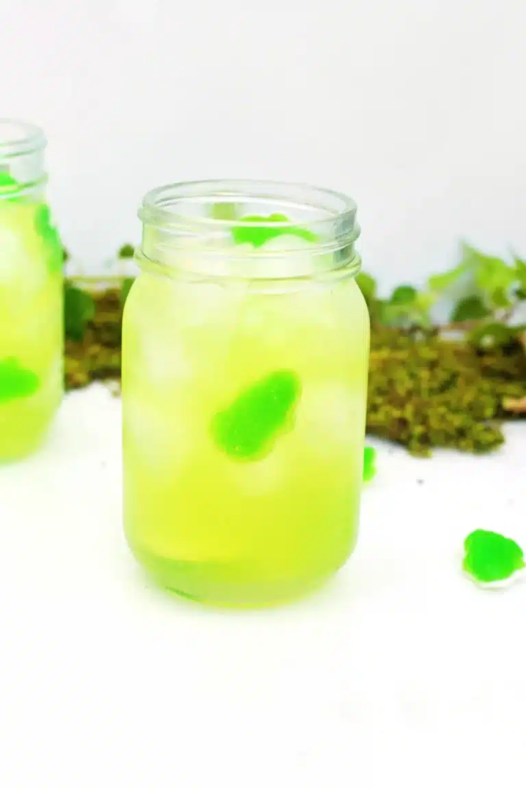 green fruit punch with a green candy frog in it