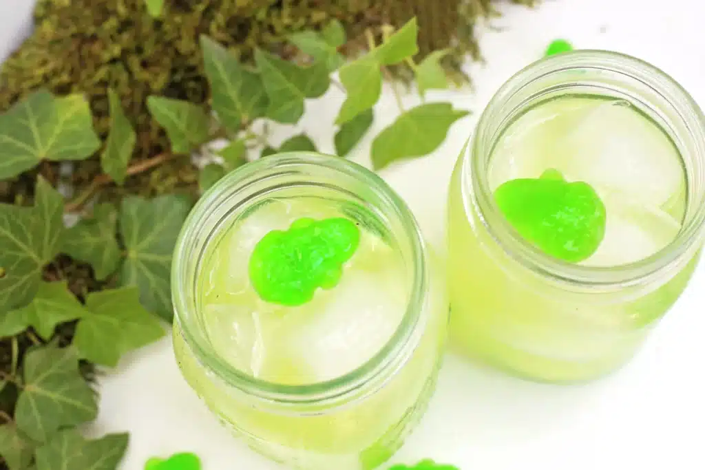Frog Pond Punch - Cultivating Brilliant Minds green fruit punch with a green candy frog in it
