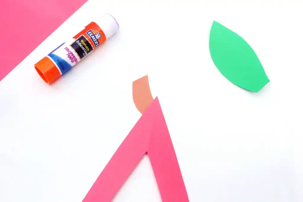 Letter A Apple Craft - Cultivating Brilliant Minds the letter a cut out of red construction paper with a brown stem on top