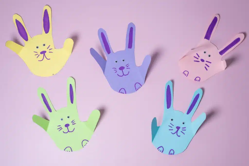 Bunny Handprint Craft - Cultivating Brilliant Minds a handprint cut out of construction paper decorated to look like a bunny