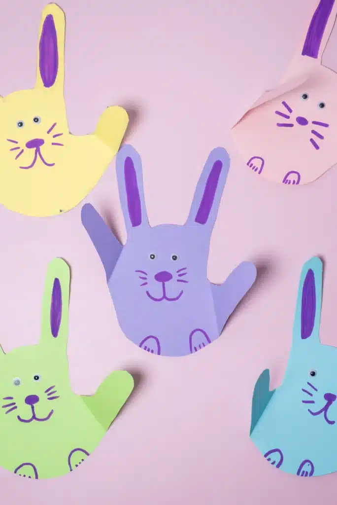 Bunny Handprint Craft - Cultivating Brilliant Minds a bunny handprint craft that is a handprint cut out of construction paper decorated to look like a bunny