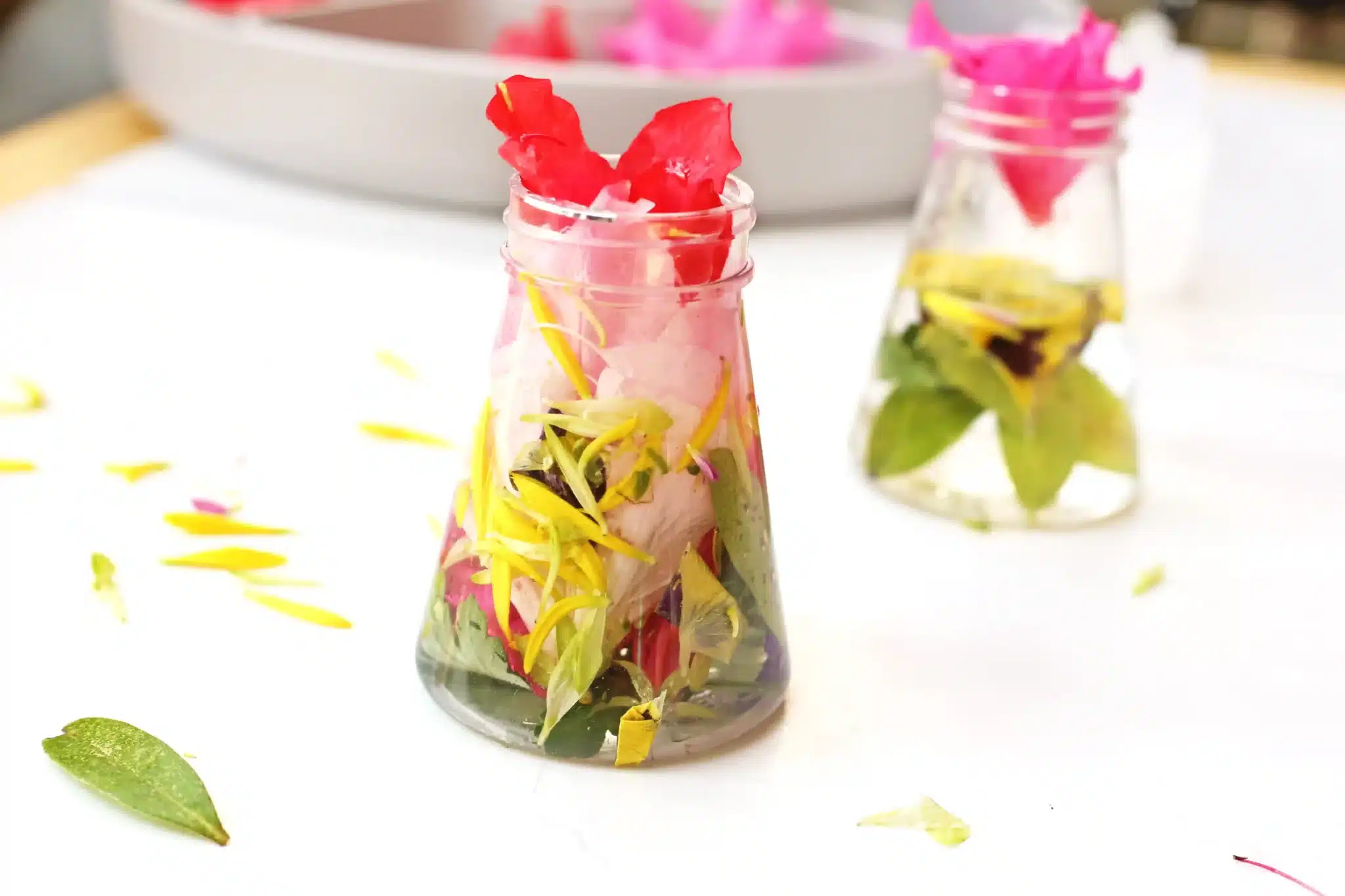 flowers in a jar with water to make flower potions