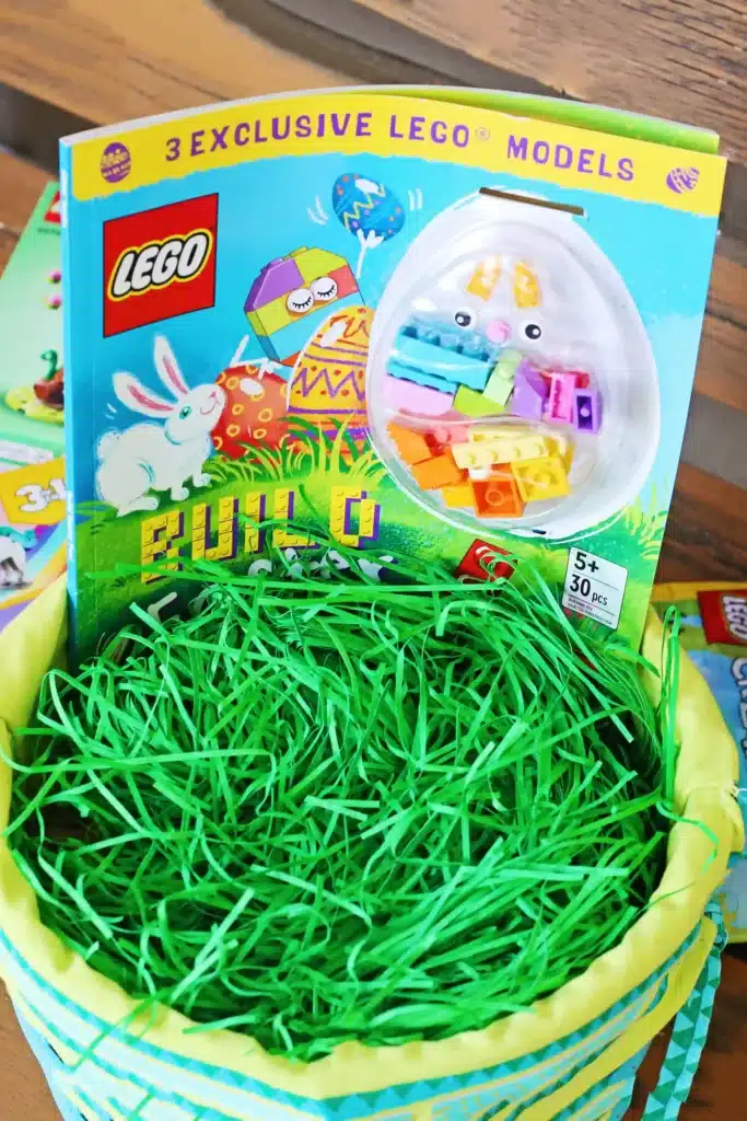 LEGO Easter Basket Ideas - Cultivating Brilliant Minds an easter basket with green easter grass and a lego book