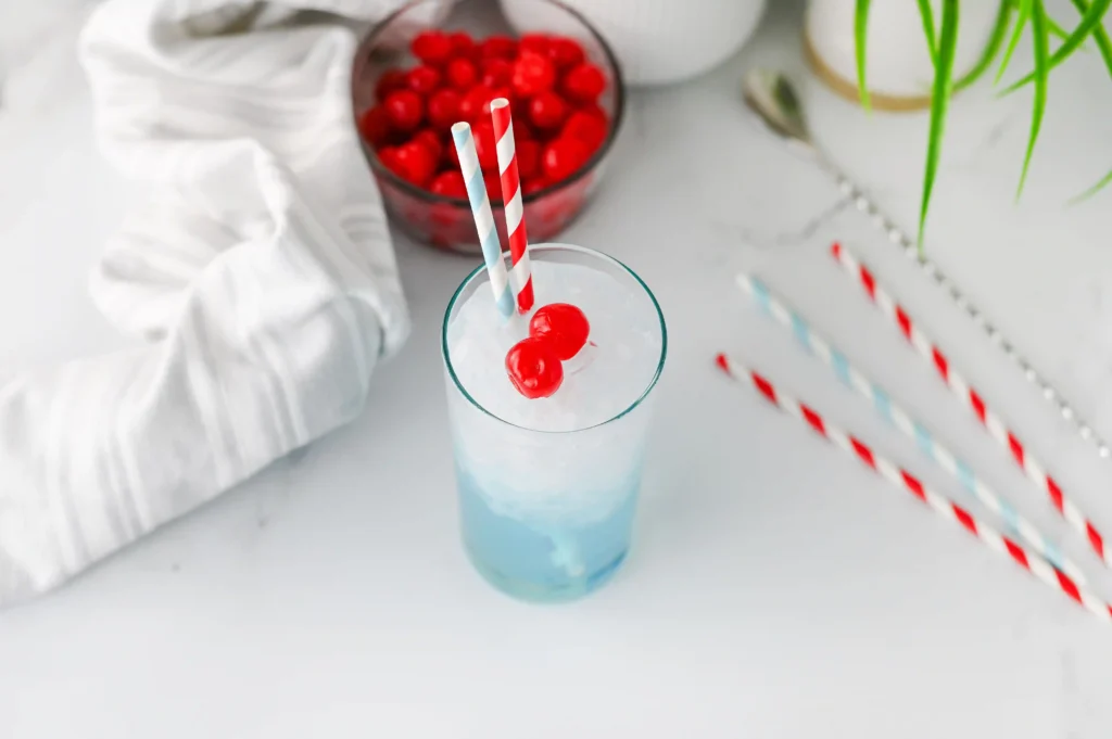 Copycat Sonic Ocean Water - Cultivating Brilliant Minds Copycat Sonic Ocean Water with a cherry and straw on a kitchen counter