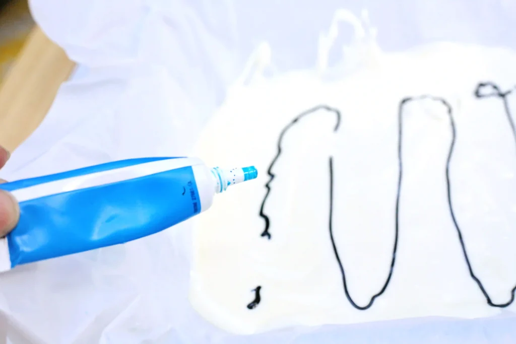 Shark Bark - Cultivating Brilliant Minds melted white chocolate with blue food coloring on it