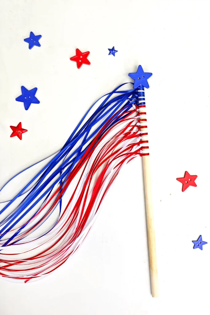American Flag Wands - Cultivating Brilliant Minds American flag wands fourth of july craft that uses string tied around a dowel and a star button
