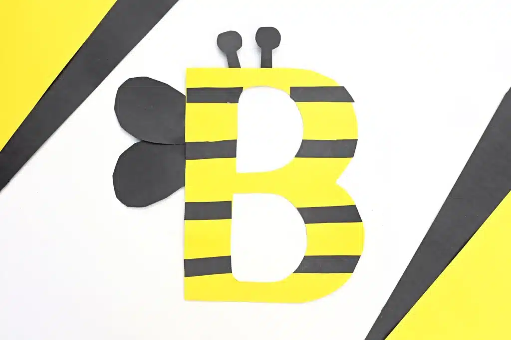 Letter B Bee Craft - Cultivating Brilliant Minds a letter b craft that uses yellow construction paper b decorated with black stripes and wings