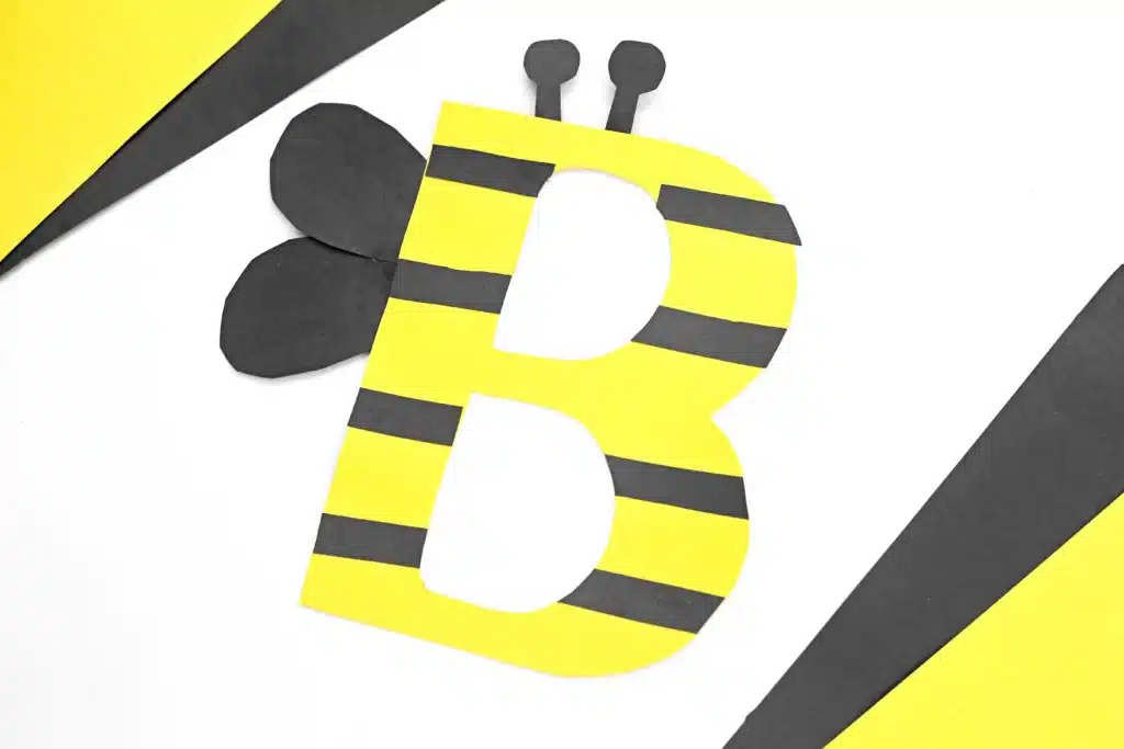 Letter B Bee Craft - Cultivating Brilliant Minds a letter b craft that uses yellow construction paper b decorated with black stripes and wings