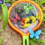 Backyard Butterfly Hunt - Cultivating Brilliant Minds a butterfly net with fake butterflies inside