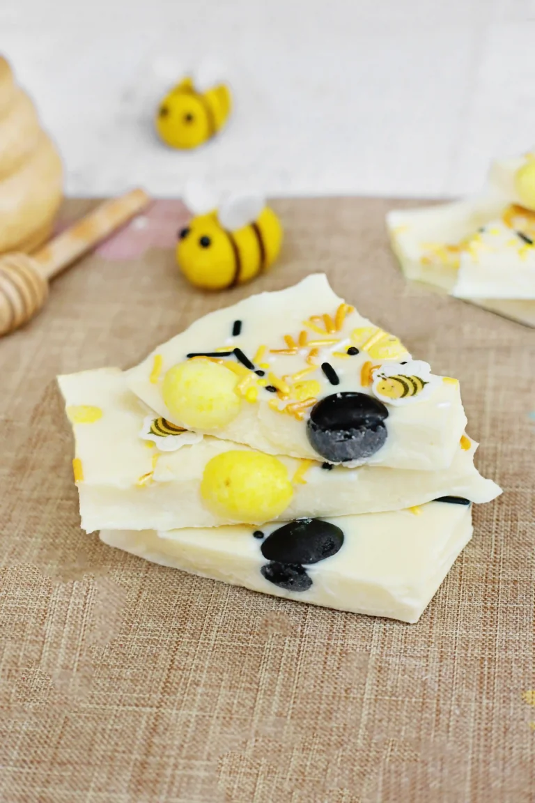 bumblebee chocolate bark made with white chocolate, jelly beans, and bee sprinkles