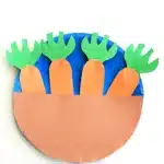 Carrot Garden Paper Plate Craft - Cultivating Brilliant Minds a paper plate painted blue with construction paper carrots