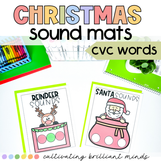 Colorful classroom scene advertising Christmas sound mats for CVC words, with two illustrated flashcards (Reindeer Sounds, Santa Sounds) on a white desk.