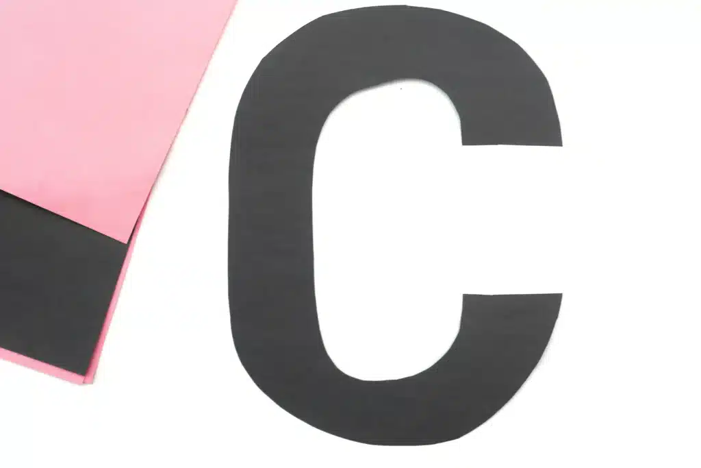 Letter C Cat Craft - Cultivating Brilliant Minds the letter c cut out of black construction paper